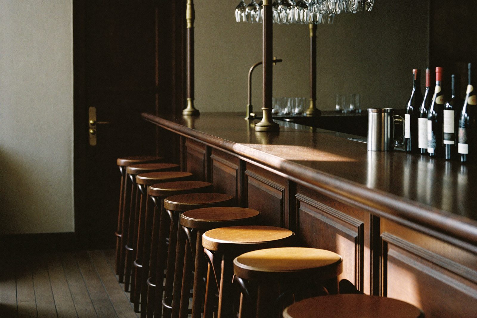 Bar counter with bottles and glassware ready for service