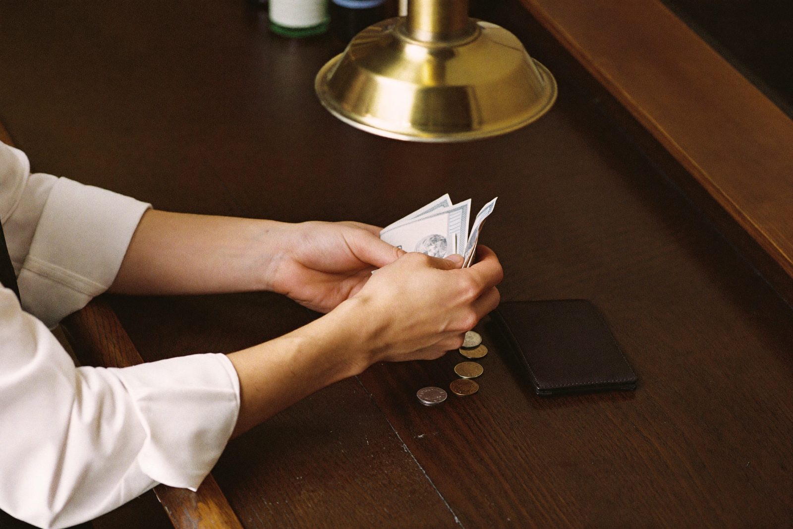 Waiter closing a bill at the counter till