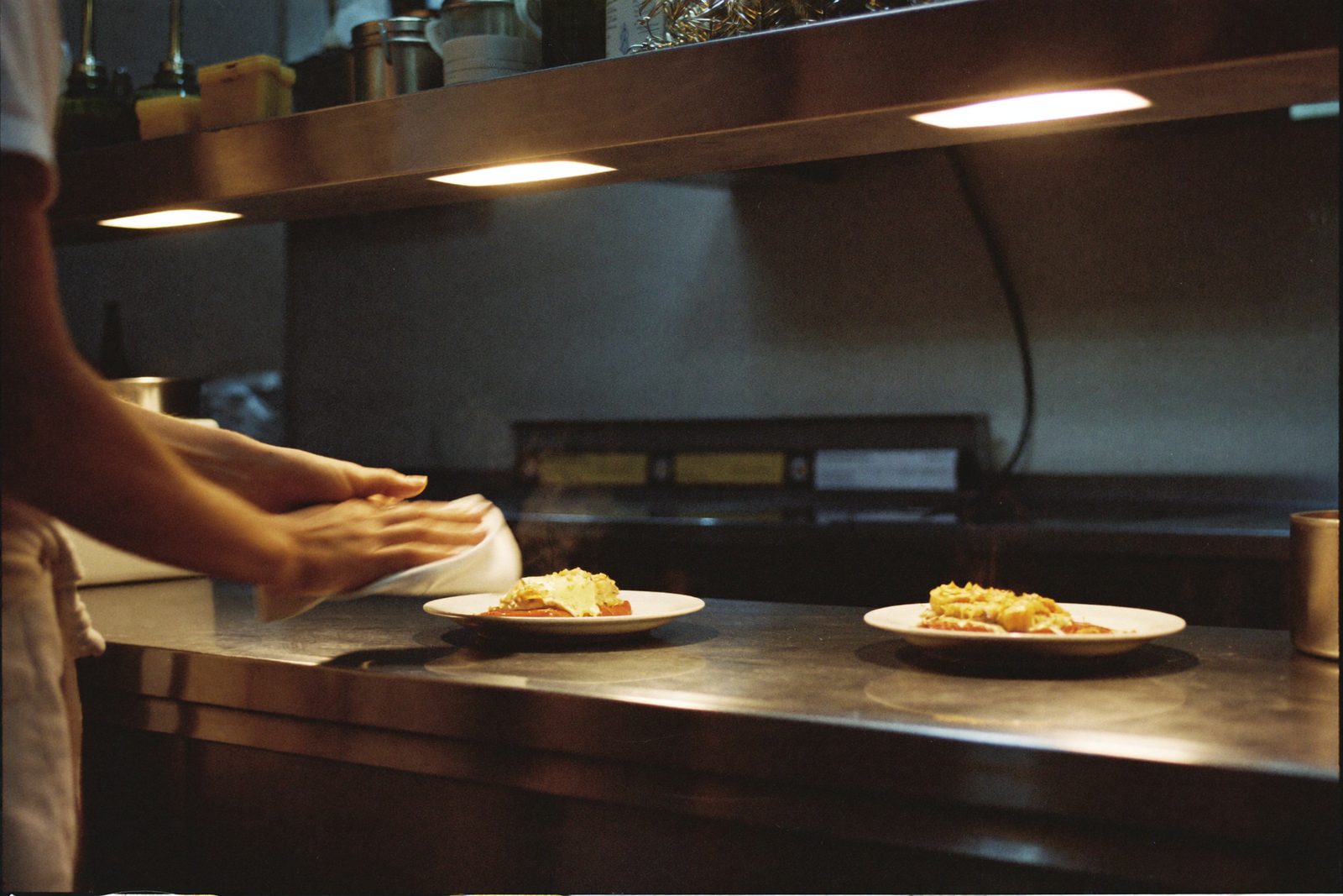Kitchen brigade working the line during service