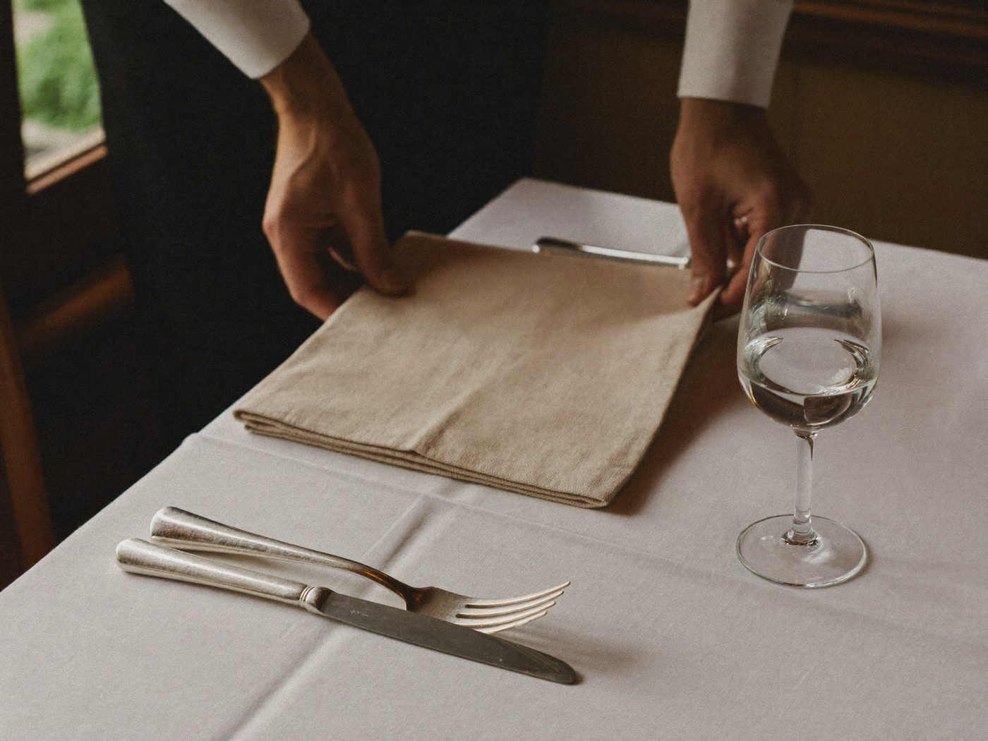 Guests raising a toast at a dressed table